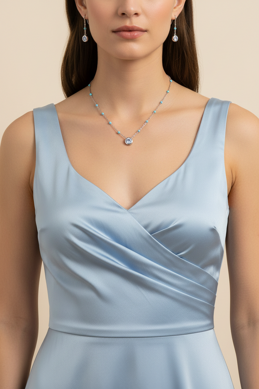 Necklace with a blue gemstone pendant on a white background